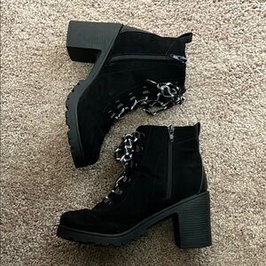black booties with white patterned laces